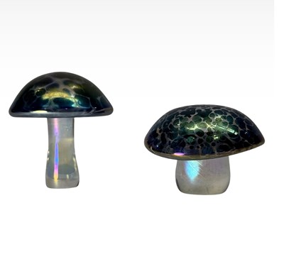 Lot 273 - Two iridescent glass mushrooms, after John...