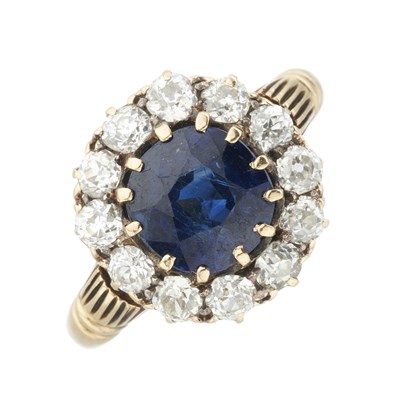 Lot 148 - A late Victorian gold sapphire and diamond cluster ring