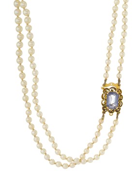 Lot 69 - A mid 20th century pearl two-row necklace, with gold sapphire clasp