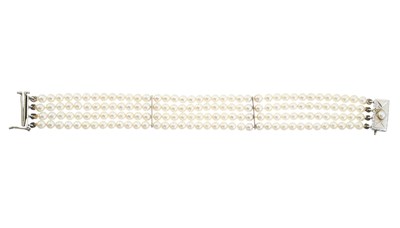 Lot 81 - A mid 20th century pearl four-row bracelet, with sliding clasp