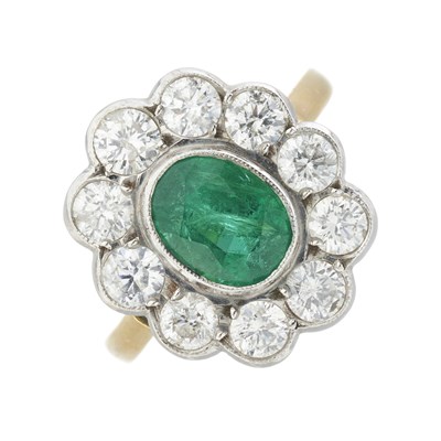 Lot 59 - An 18ct gold emerald and diamond cluster ring