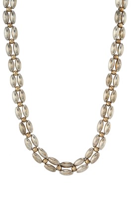 Lot 102 - Cartier, a vintage silver and gold two-row necklace