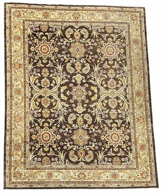 Lot 580 - A large oriental rug, oatmeal and brown ground...