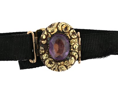 Lot 8 - An amethyst bracelet on cord