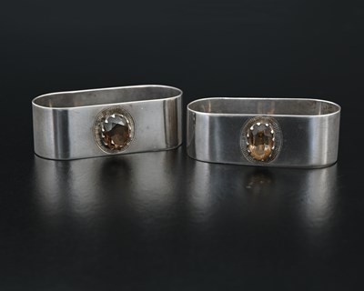 Lot 142 - Two George VI silver napkin rings, of oval...