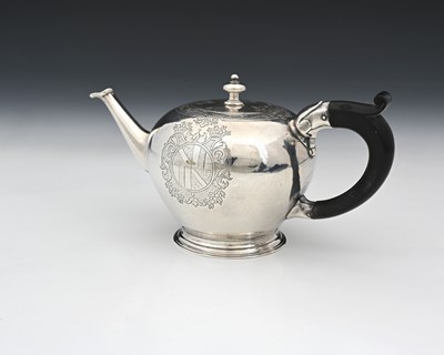 Lot 153 - A George II silver bullet shape teapot, the...