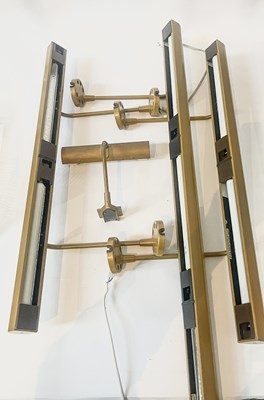 Lot 193 - Three bronzed metal picture lights by Linolite,...