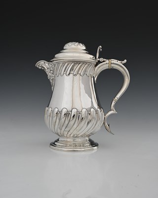 Lot 345 - A Victorian silver jug, of baluster form, the...