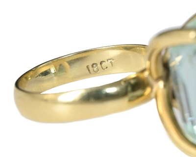 Lot 52 - A yellow metal aquamarine single-stone ring