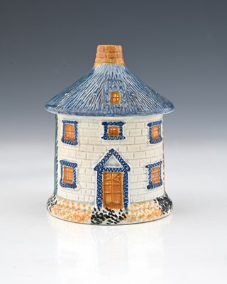 Lot 841 - A Staffordshire Prattware thatched cottage...