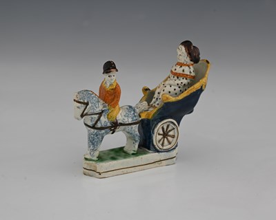 Lot 850 - A small Staffordshire Prattware figure of a...