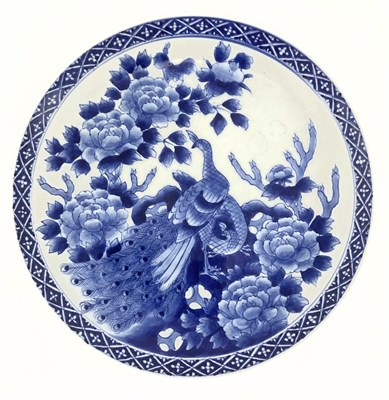 Lot 138 - A Japanese blue and white charger, Meiji...