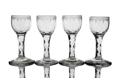 Lot 638 - A set of four facet cut wine glasses, circa...