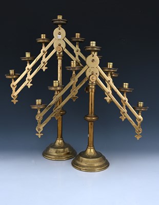 Lot 231 - A pair of Gothic Revival brass adjustable...