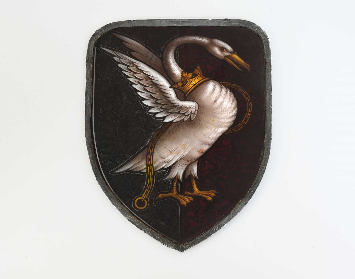 Lot 268 - An Arts and Crafts stained glass shield form