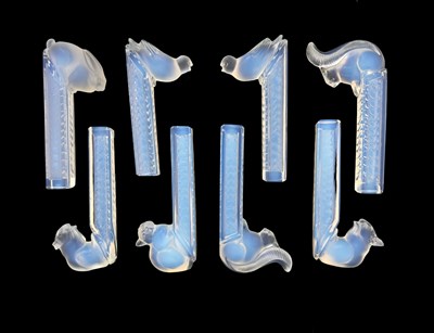 Lot 667 - Etling, a set of eight Art Deco opalescent...