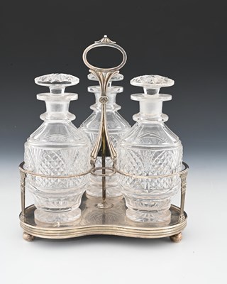 Lot 173 - A George III silver-mounted three-bottle...