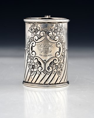 Lot 149 - An Edwardian silver mug, of cylindrical form,...