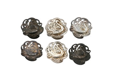 Lot 212 - A set of six Art Nouveau white metal buttons,...