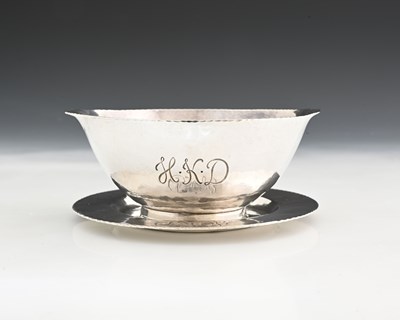 Lot 222 - A George V Arts and Crafts style silver bowl...