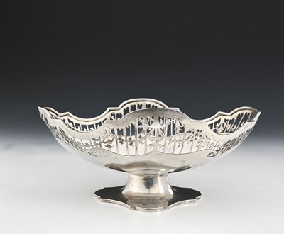 Lot 170 - A George V silver pedestal basket, of navette...