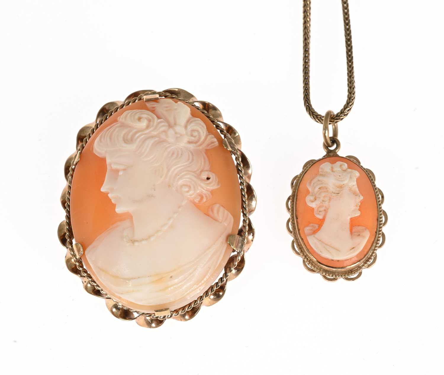 Lot 33 - Two 9ct gold shell cameo pendants, one with chain