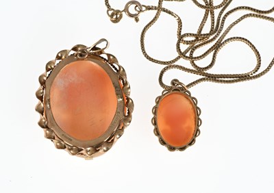 Lot 33 - Two 9ct gold shell cameo pendants, one with chain