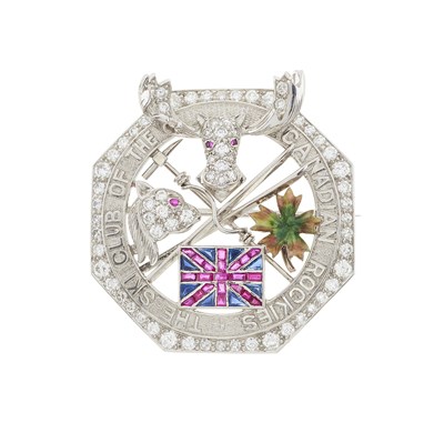 Lot 115 - Cartier, a platinum diamond, ruby, sapphire and enamel Canadian Ski Club brooch