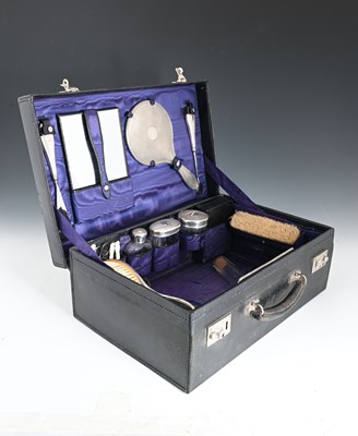 Lot 160 - An Edwardian leather fitted dressing-case, the...