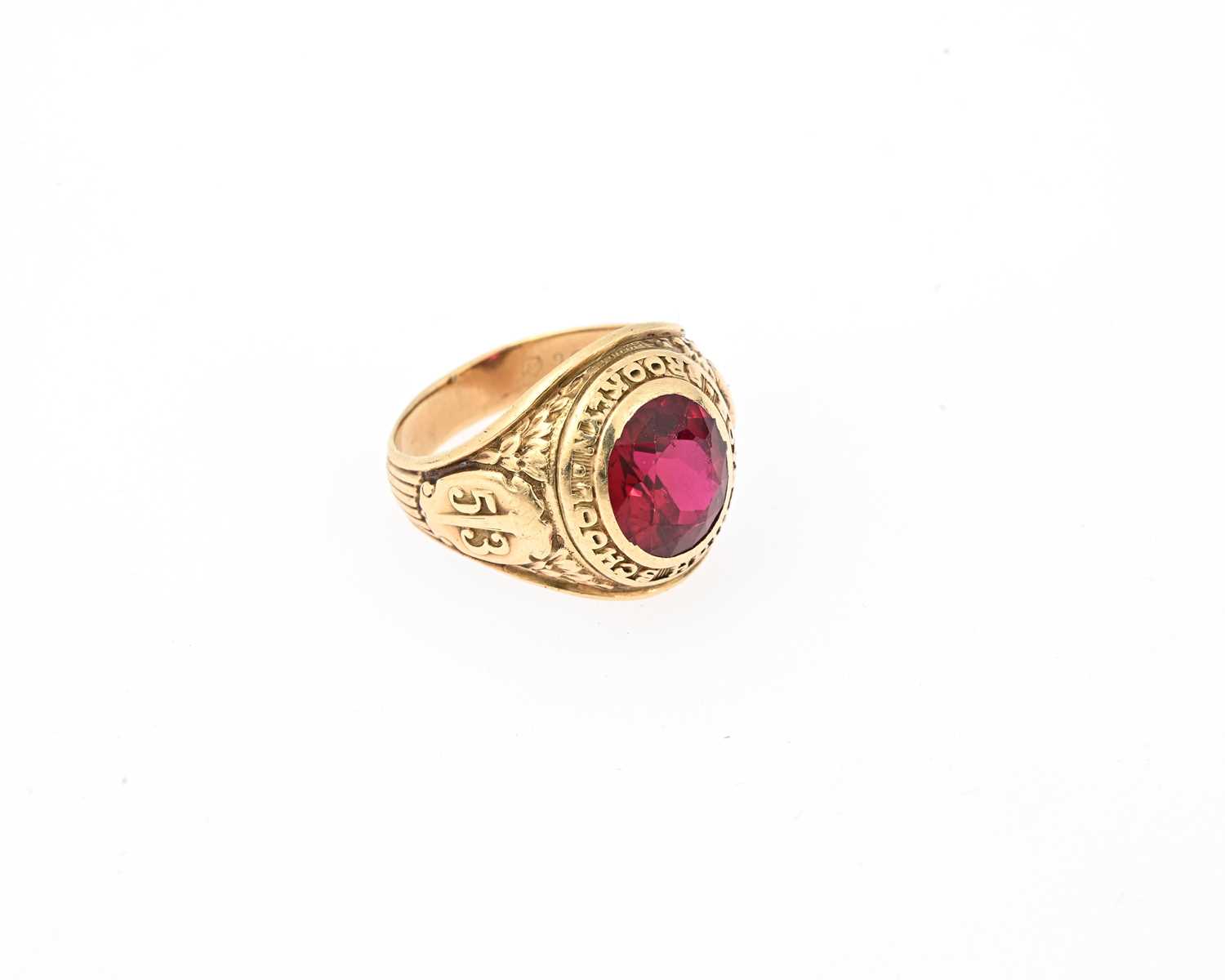 Lot 34 - A 10ct gold red gem college signet ring