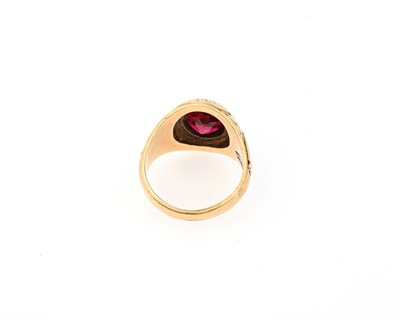 Lot 34 - A 10ct gold red gem college signet ring