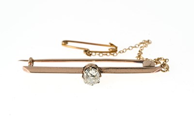 Lot 26 - An early 20th century gold diamond single-stone bar brooch