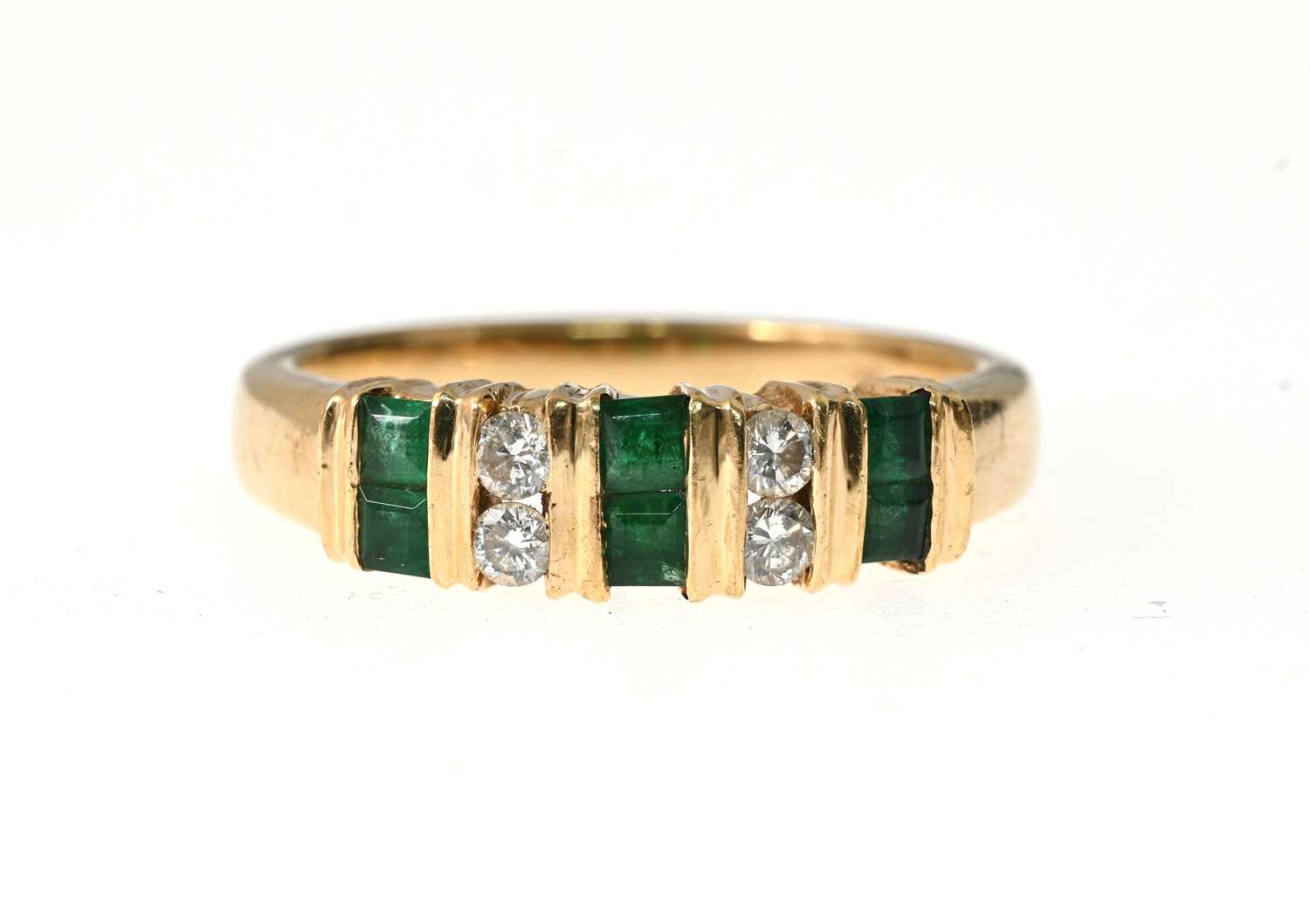 Lot 18 - A 14ct gold emerald and diamond dress ring