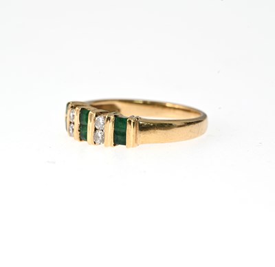 Lot 18 - A 14ct gold emerald and diamond dress ring