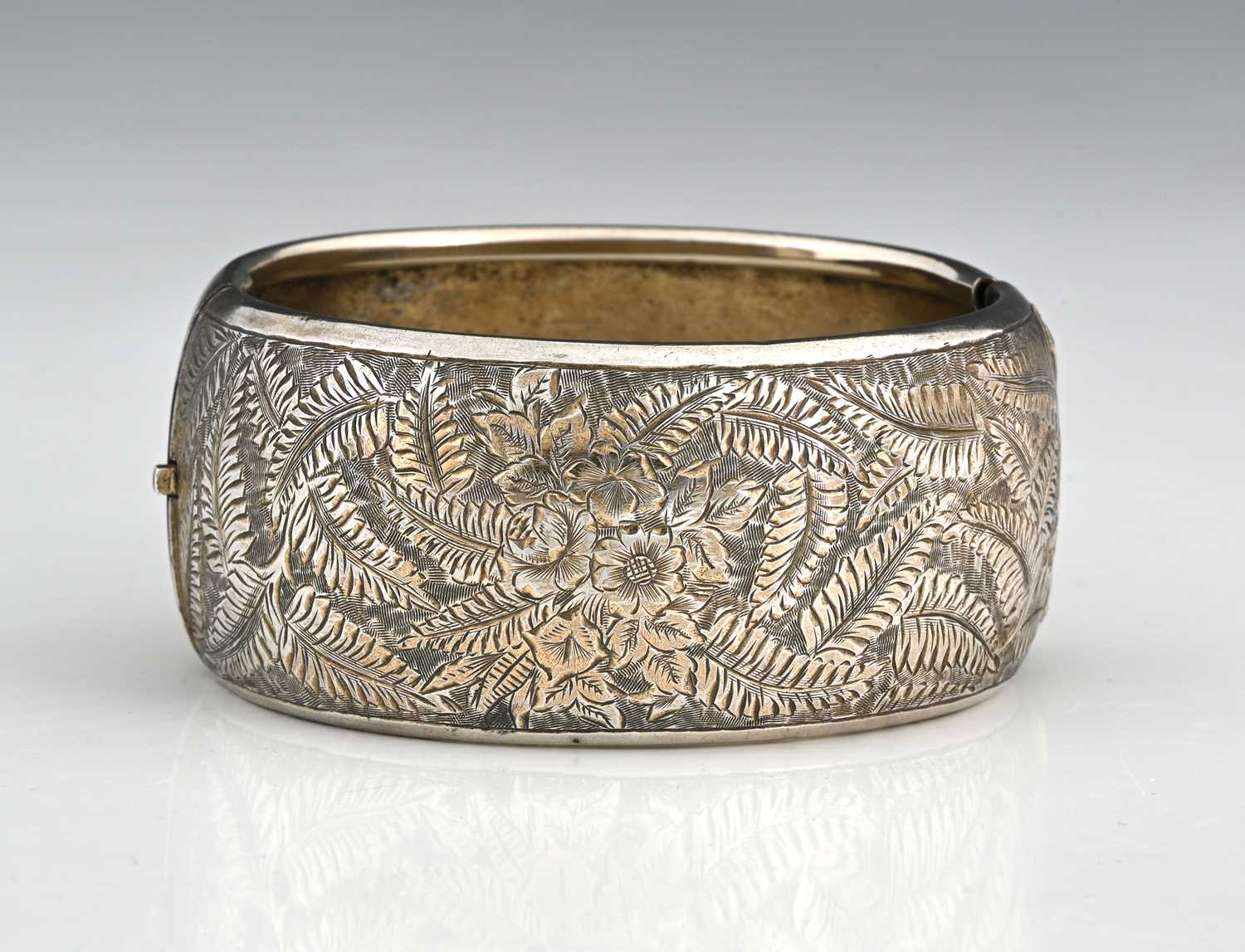 Lot 2 - A late Victorian silver engraved bangle bracelet