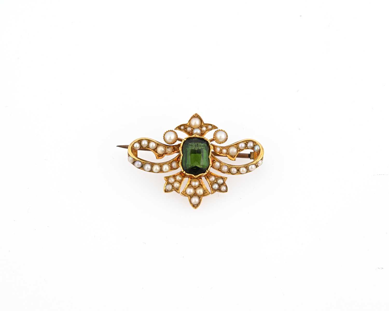 Lot 17 - An Edwardian gold green tourmaline and pearl brooch