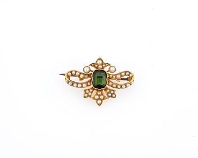 Lot 17 - An Edwardian gold green tourmaline and pearl brooch