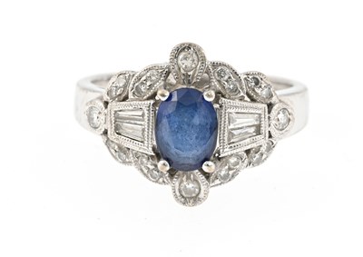 Lot 56 - An 18ct gold sapphire and diamond dress ring