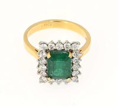 Lot 53 - An 18ct gold emerald and diamond cluster ring