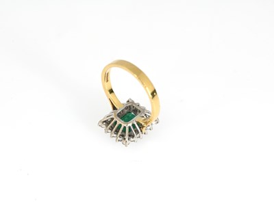 Lot 53 - An 18ct gold emerald and diamond cluster ring