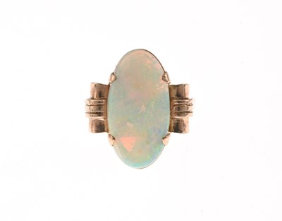 Lot 23 - A 1940s gold opal single-stone dress ring