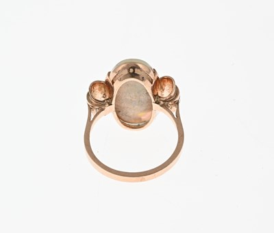 Lot 23 - A 1940s gold opal single-stone dress ring