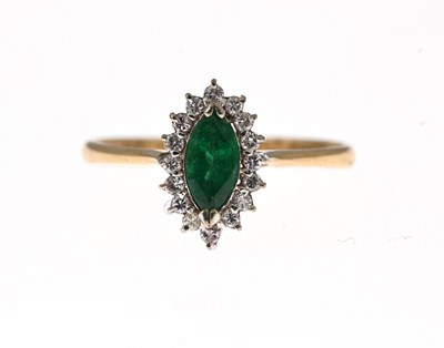 Lot 35 - A 14ct gold emerald and diamond cluster ring