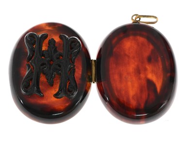 Lot 13 - A late Victorian tortoiseshell locket pendant