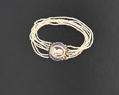 Lot 37 - A late Georgian pearl seven-row bracelet, with enamel portrait clasp