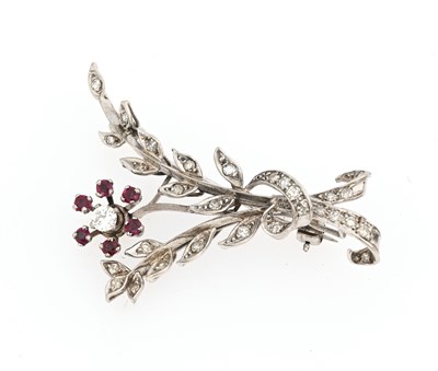 Lot 25 - A mid 20th century white metal diamond and ruby floral spray brooch