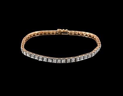 Lot 19 - A 9ct gold diamond line bracelet