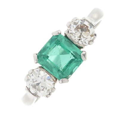 Lot 118 - An 18ct gold emerald and diamond three-stone ring