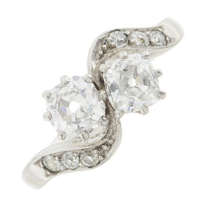 Lot 140 - An Art Deco platinum diamond two-stone crossover ring