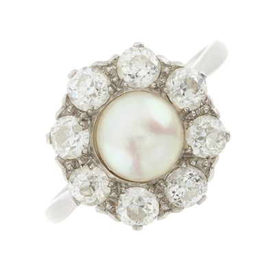 Lot 20 - An early 20th century platinum pearl and diamond cluster ring